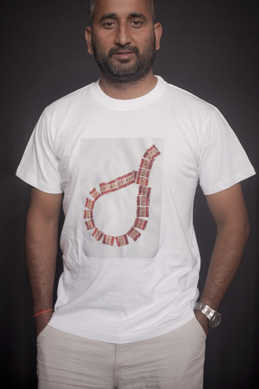 T-Shirt Gairimudi Artwork by: Collaborative work by Gairimudi-8 kids with Chocolate Rapper Available Colors- White, Black Available Size- S/M/L Price: RS. 800/- An artwork on the t-shirt is done by Shova Thapa from Gairimudi, Dolakha and the processed form the sale goes back to fund themselves.
